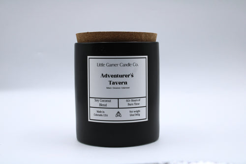 Black candle with a cork lid and label on a white background